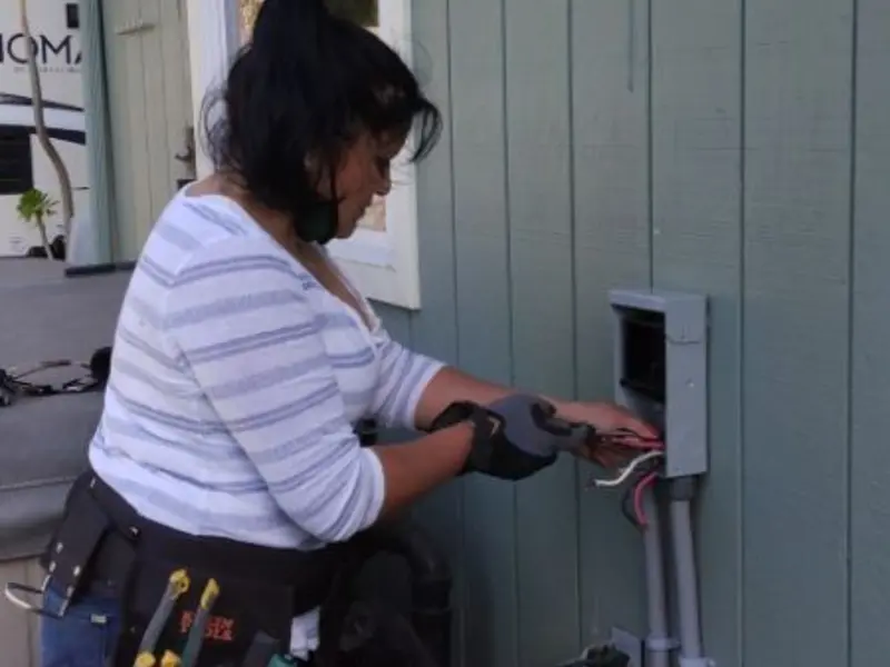 Licensed electrician wiring an exterior subpanel in Conoy