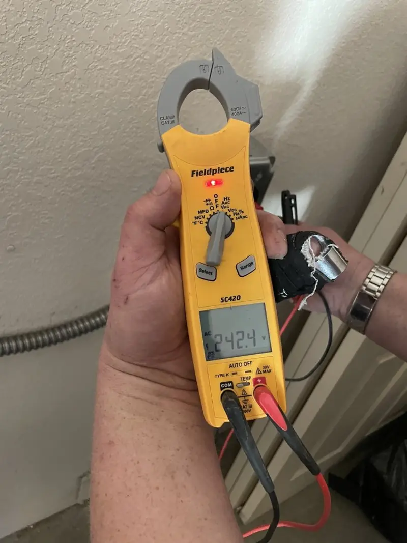 Voltage testing with clamp meter during Whole House Surge Protector in Conoy